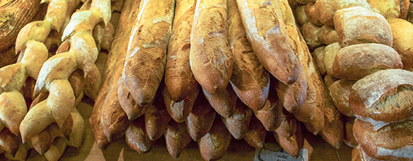 lightly floured stack of handmade french baguettes