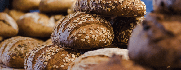 Honey oat bread has horizontal cuts flecked with hearty oats